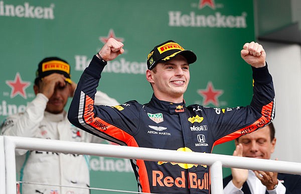 Max Verstappen celebrates at the podium Sunday after winning the Formula One Brazilian Grand Prix at the Interlagos race track in Sao Paulo, Brazil.