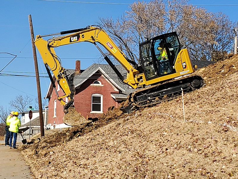 Workers, Tuesday, remove a sewer line on Missouri American Water property near the intersection of West Main Street and Brooks Street. This is part of prepatory work for improvements to Missouri American's water plant that is scheduled to be complete by Nov. 2020.