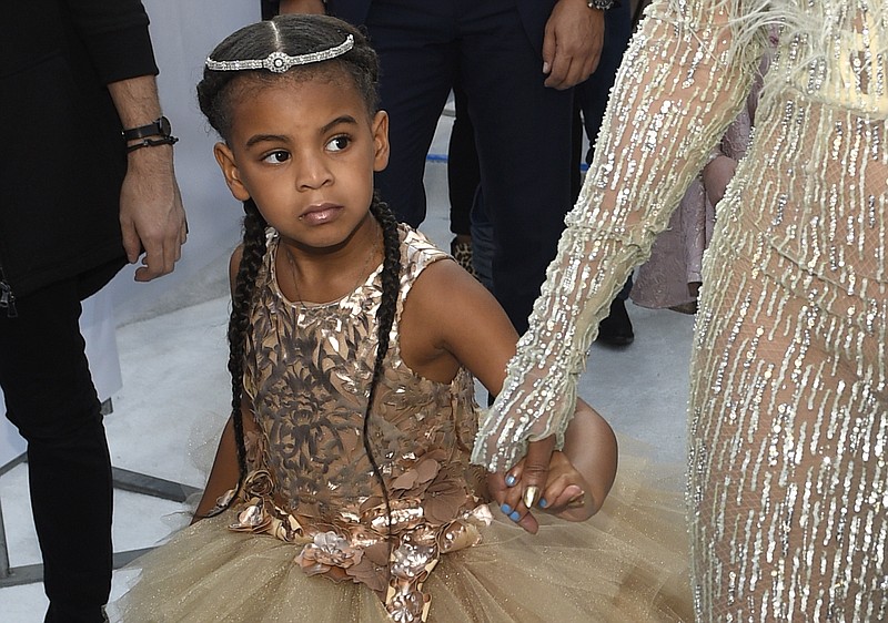 FILE - In this Aug. 28, 2016 file photo, Blue Ivy, daughter of Beyonce, arrives at the MTV Video Music Awards at Madison Square Garden in New York. At just 7, Blue Ivy Carter is an award-winning songwriter. Jay-Z and Beyoncé’s daughter won the Ashford & Simpson Songwriter’s Award at the Soul Train Awards on Sunday, Nov 17, 2019, for co-writing her mom’s hit “Brown Skin Girl,” a song celebrating dark- and brown-skinned women. Ivy gives a vocal performance that opens and closes the song, which also features Wizkid and Saint Jhn.(Photo by Chris Pizzello/Invision/AP, File)