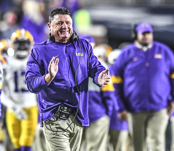 LSU coach Ed Orgeron smiles following an LSU touchdown against Mississippi during Saturday's game in Oxford, Miss.