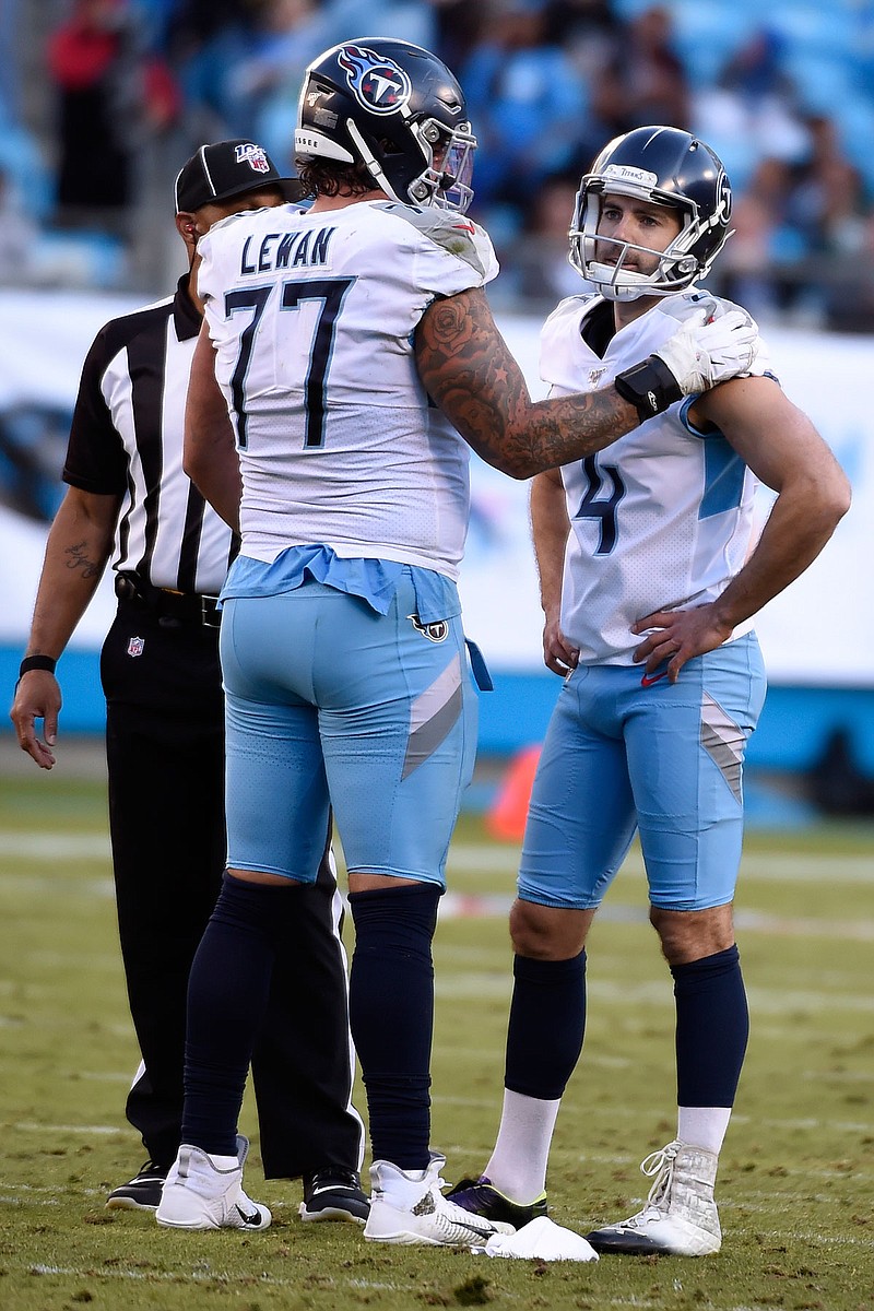 Titans offensive tackle Taylor Lewan (77) reacts with kicker Ryan Succop following Succop's missed field-goal attempt during a game earlier this month game against the Panthers in Charlotte, N.C.