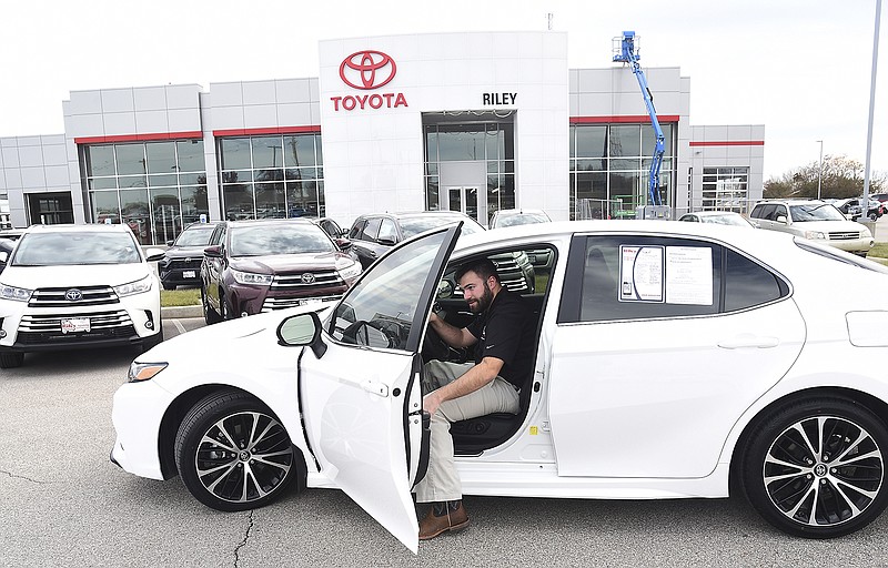 Ken Bowen, a sales consultant at Riley Toyota, pulls out a car for a customer Wednesday at the 2105 Christy Drive location. Kevin Riley of Riley Chevrolet and RIley Toyota, both of which sustained heavy damage in the May 22 tornado, applied for a disaster recovery loan through the LIFT program.