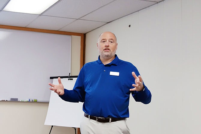 Bob Beckmann, project manager for nonprofit Missouri Enterprise, tells local business men and women about how to attract and retain millennials. It's going to require some change for many companies, he said.