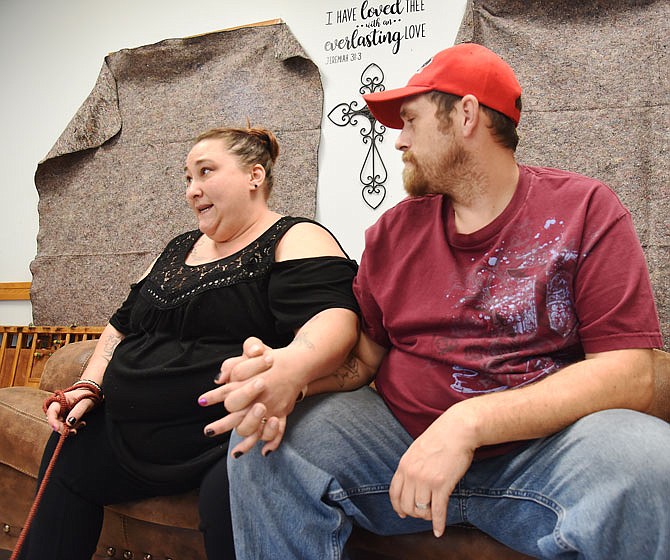 Justin Cobb grabs his wife, Sarah's, hand to try and comfort her as she becomes emotional while talking about their tornado experience, being homeless and trying to maintain some sort of normalcy for their daughter. The couple was recently seated for an interview at The Salvation Army Center of Hope. The couple and two of their daughters were living in a house on East McCarty Street when the tornado hit. 