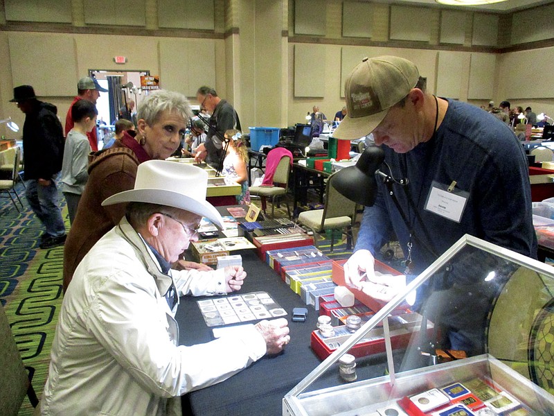 Local coin collectors and enthusiasts attend the 48th annual Texarkana Coin Show held Friday and Saturday at the Texarkana, Texas, Convention Center. The show usually attracts from 200 to 500 visitors each year.
