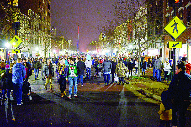 Guests crowd Nov. 30, 2018, on East High Street during the annual Living Windows event.