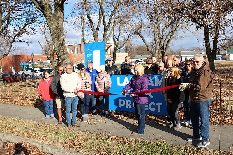 California Progress, Inc. hosted a ribbon cutting for progress signage erected at the Latham Sanitarium lot Saturday, where it was joined by members of the California Area Chamber of Commerce. CPI is currently seeking donations to help pay for the cost of the property, originally set at $95,000 after CPI's initial deposit when it first signed the purchase contract. As of Saturday, CPI has raised around $50,000 in total for the project, of which the entire amount is due by Dec. 10.