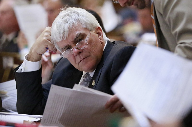 FILE - In this March 22, 2016 file photo, House Ways and Means Chairman state Rep. Jay Powell, R-Camilla, looks over legislation on the House floor, in Atlanta. Powell has died Monday, Nov. 25, 2019, after suddenly collapsing at a lawmaker retreat in Georgia. (Bob Andres/Atlanta Journal-Constitution via AP)