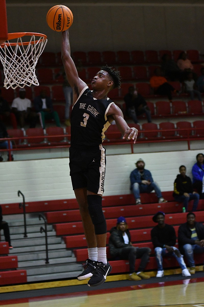 Pleasant Grove's T'vondrick Henry goes up for a dunk on Tuesday at Razorback Gym. Arkansas High defeated the Hawks, 81-65. (Photo by Kevin Sutton)
