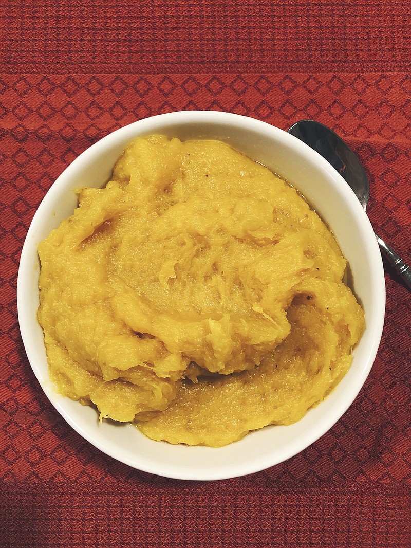 This Oct. 22, 2019 photo shows cooked mashed squash in Amagansett, N.Y. The squash roasted whole and uncut has more flavor than roasting it in chunks or boiling it. (Elizabeth Karmel via AP)