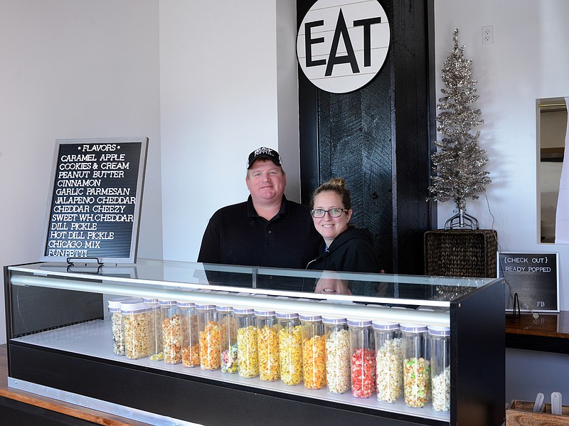 Sally Ince/ News Tribune
Luke and Kara Ready stand behind the counter of their their new location Wednesday December 11, 2019 at Ready Popped on West McCarty Street. 