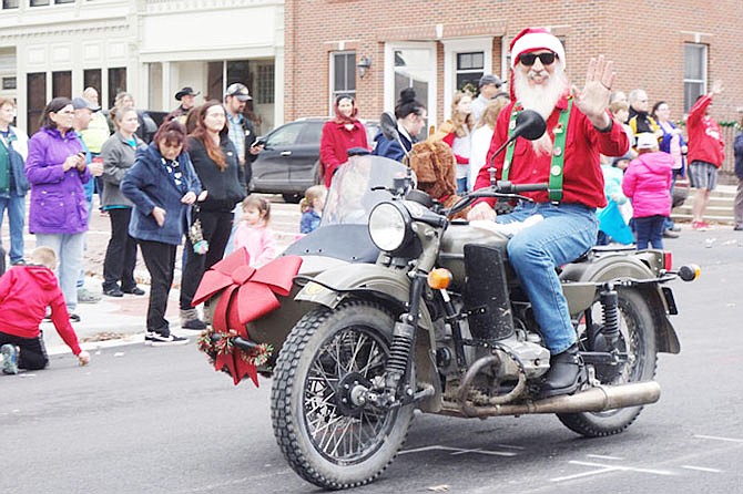 FILE: Mack McDaniel was the coolest Santa in the 2018 Fulton Jaycees' Christmas Parade. He introduced his reindeer-suited co-pilot, Terri McDaniel, as "my deer."