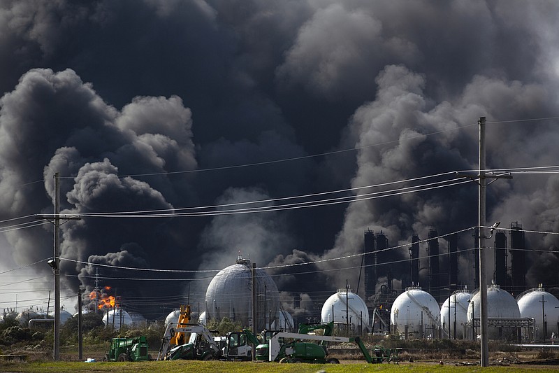 Smoke from an explosion at the TPC Group plant is seen Wednesday, Nov. 27, 2019, in Port Neches, Texas. Two massive explosions 13 hours apart tore through the chemical plant Wednesday, and one left several workers injured. (Marie D. De Jess/Houston Chronicle via AP)