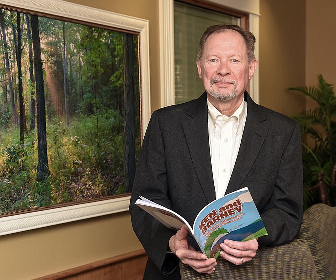 John Landwehr can now add author to his list of accomplishments. The local attorney and former mayor self-published the book he's holding, titled "Ken and Barney," which is a collection of stories he told his children as they were growing up.