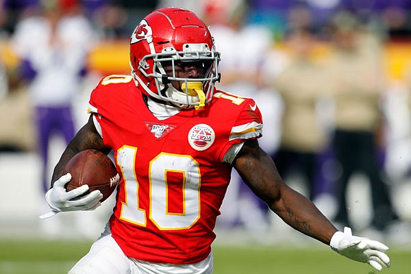 Chiefs wide receiver Tyreek Hill carries the ball during a game earlier this month against the Vikings at Arrowhead Stadium.