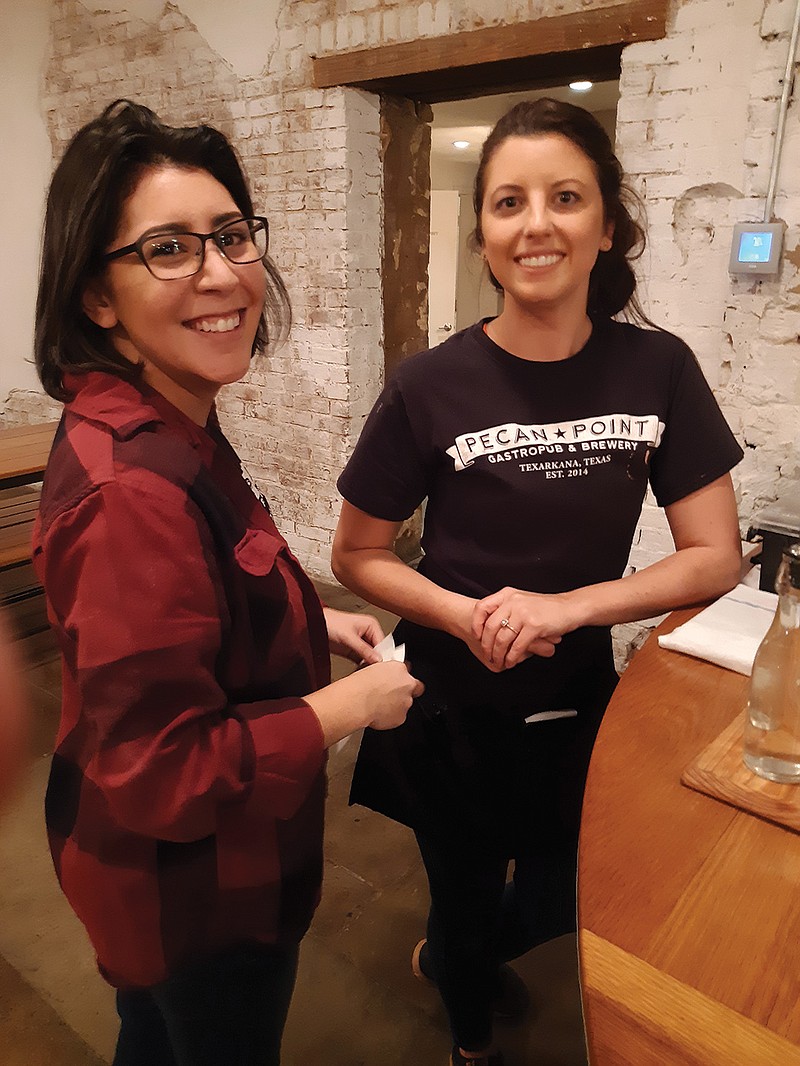 Libby Hernandez and Makayla Tacker work a busy Saturday at Pecan Point Gastropub and Brewery, one of the local businesses participating in Small Business Saturday.