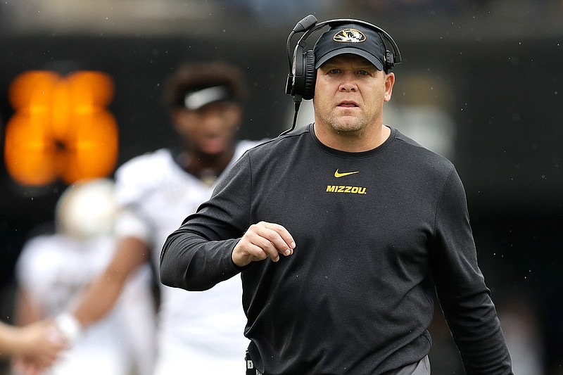  In this Oct. 19, 2019 file photo, Missouri head coach Barry Odom watches from the sideline in the first half of an NCAA college football game against Vanderbilt in Nashville, Tenn.   A person with direct knowledge of the decision says Missouri has fired Odom. The person spoke to The Associated Press on condition of anonymity Saturday, Nov. 30,  because no announcement has been made.  (AP Photo/Mark Humphrey, File)