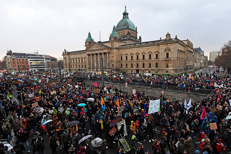 Thousands of demonstrators attend a protest climate strike ralley of the 'Friday For Future Movement' in front of the Federal Administrative Court building in Leipzig, Germany, Friday, Nov. 29, 2019. Cities all over the world have strikes and demonstrations for the climate during this ClimateActionDay. (AP Photo/Jens Meyer)