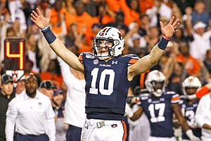 Auburn quarterback Bo Nix reacts after a penalty gave Auburn a first down and secured the win against Alabama during the second half of Saturday's game in Auburn, Ala. Auburn won 48-45.