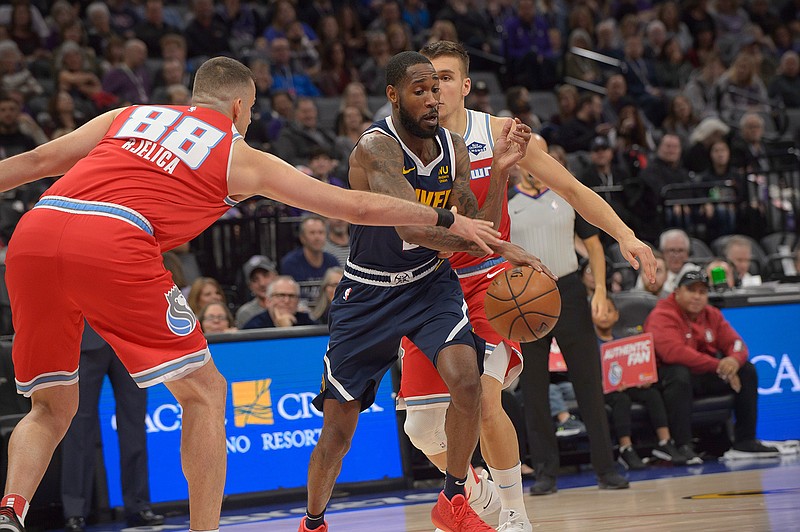 Sacramento Kings forward Nemanja Bjelica (88) defends against Denver Nuggets guard Will Barton (5) during the first quarter of an NBA basketball game in Sacramento, Calif., Saturday, Nov. 30, 2019 . (AP Photo/Randall Benton)