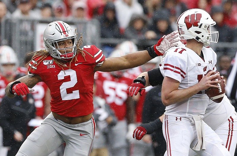 Ohio State Buckeyes defensive end Chase Young (2) pressures Wisconsin Badgers quarterback Jack Coan (17) during the second quarter of the NCAA football game at Ohio Stadium in Columbus, Ohio on Saturday, Oct. 26, 2019. (Adam Cairns/The Columbus Dispatch/TNS)