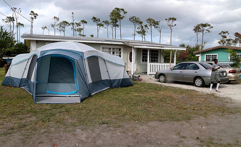 Tents are seeing in front of many houses in Freeport, Bahamas' neighborhoods as the islands residents still struggling after Hurricane Dorian on Saturday, November 23, 2019. (Pedro Portal/Miami Herald/TNS)