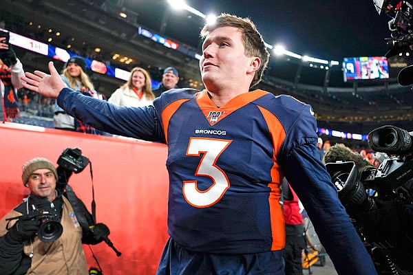 Broncos quarterback Drew Lock leaves the field after their win Sunday against the Chargers in Denver. The former Missouri quarterback won 23-20 in his NFL debut.
