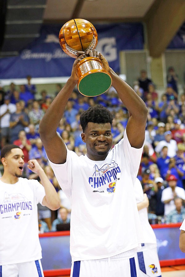 Kansas center Udoka Azubuike raises the MVP trophy after he and guard Devon Dotson shared the award last Wednesday at the Maui Invitational in Lahaina, Hawaii.