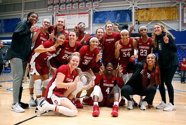 Stanford celebrates winning the Greater Victoria Invitational championship 67-62 against Mississippi State 67-62 on Saturday in Victoria, British Columbia.