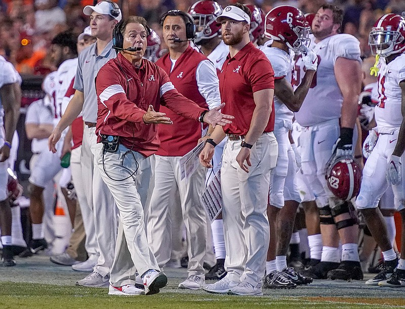 Alabama head coach Nick Saban disagrees with a call in the second half of an NCAA college football game against Auburn in Auburn, Ala., on Saturday, Nov. 30, 2019. (Chris Shimek/The Decatur Daily via AP)