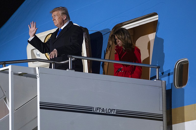 President Donald and first lady Melania Trump arrive at London Stansted Airport to attend the NATO summit, Monday, Dec. 2, 2019, in London. (AP Photo/ Evan Vucci)