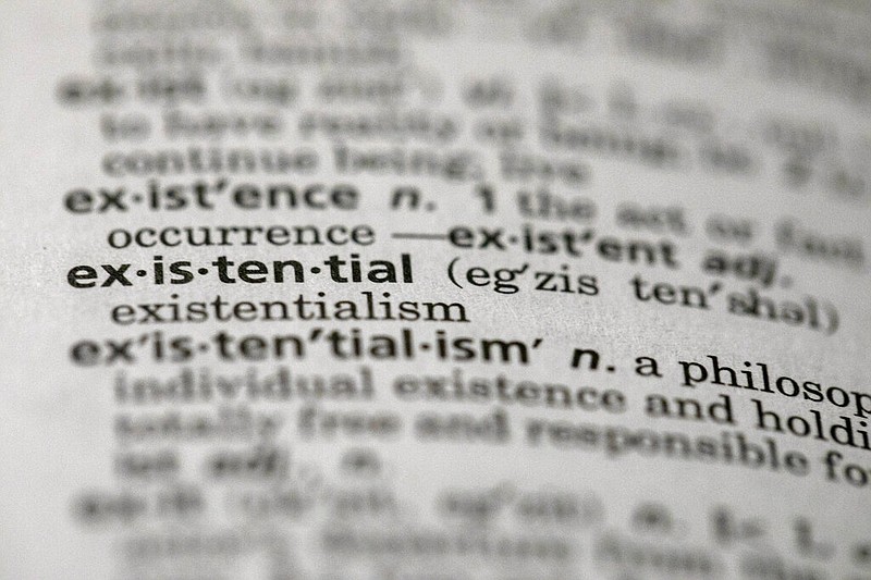 This Sunday, Dec. 1, 2019, photo shows the word "existential" in a dictionary in the Brooklyn borough of New York. Dictionary.com picked "existential" as the word of the year. The choice reflects months of high-stakes threats and crises, real and pondered, across the news, the world and throughout 2019. (AP Photo/Jenny Kane)