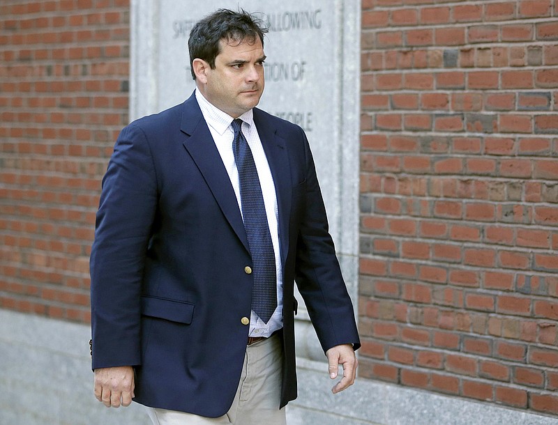 FILE - In this March 12, 2019 file photo, John Vandemoer, former head sailing coach at Stanford, arrives at federal court in Boston to plead guilty to charges in a nationwide college admissions bribery scandal. Stanford University says it conducted a review that found the mastermind behind the college admissions bribery scandal had approached seven coaches about potential sports recruits over the past decade. Only one of them, Vandemoer, went along with the scheme proposed by college consultant Rick Singer, it says. Stanford also says it has adopted new policies to strengthen admission oversight. (AP Photo/Steven Senne, File)