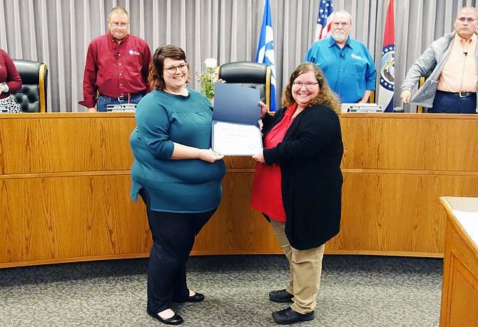 City clerk Courtney Crowson, left, was recognized Nov. 26 for her achievement in becoming a certified municipal clerk. Melissa Stradt, city clerk for Camdenton, visited to present a certificate marking the occasion. Crowson earned the certification in July. "You're to be commended for your continued support of Courtney," Stradt told city administrators.