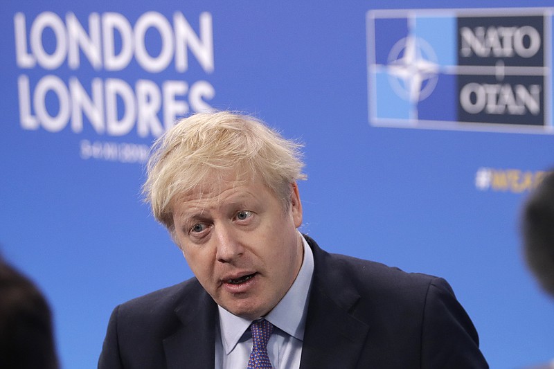 British Prime Minister Boris Johnson arrives for a NATO leaders meeting at The Grove hotel and resort in Watford, Hertfordshire, England, Wednesday, Dec. 4, 2019. As NATO leaders meet and show that the world's biggest security alliance is adapting to modern threats, NATO Secretary-General Jens Stoltenberg is refusing to concede that the future of the 29-member alliance is under a cloud. (AP Photo/Matt Dunham)