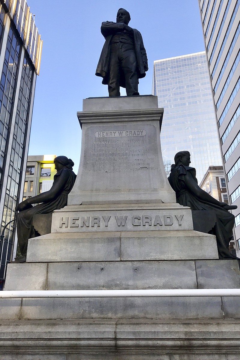 Some Georgia State University students are demanding that Atlanta's mayor remove a prominent statue of Henry Grady from downtown Grady was a newspaper editor who advocate, seen Wednesday, Dec. 4, 2019, in Atlanta. Grady was a newspaper editor who advocated for a "New South" after the Civil War, but the students say he was a racist. (AP Photo/Jeff Martin)