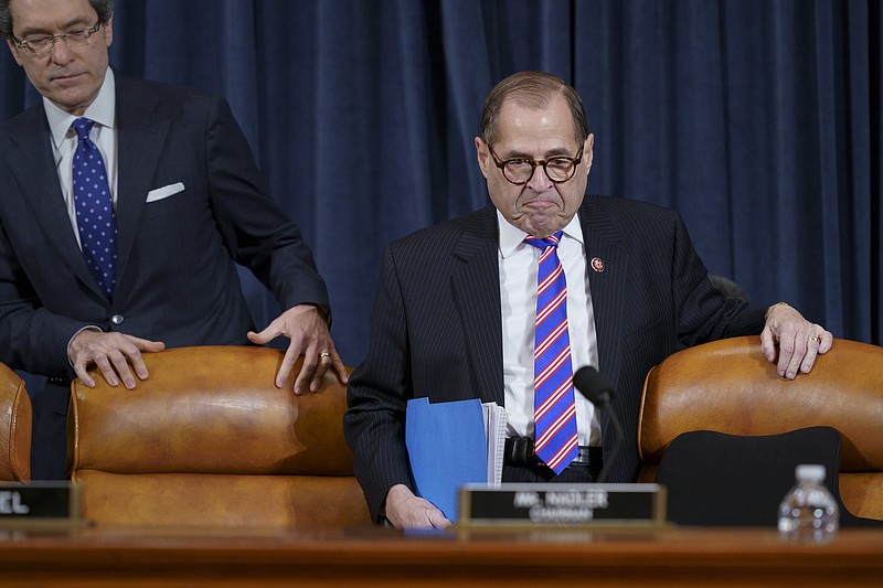 House Judiciary Committee Chairman Rep. Jerrold Nadler, D-N.Y., joined at left by Democratic counsel Norm Eisen, arrives at a hearing on the constitutional grounds for the impeachment of President Donald Trump, on Capitol Hill in Washington, Wednesday, Dec. 4, 2019. (AP Photo/J. Scott Applewhite)