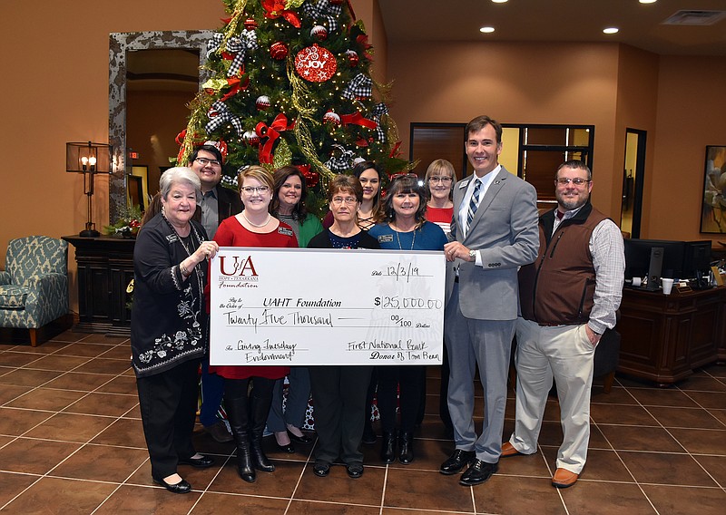 The First National Bank of Tom Bean-Hope Branch celebrated #GivingTuesday on Dec. 3 by donating $25,000 to the University of Arkansas Hope-Texarkana Foundation to establish the First National Bank of Tom Bean-Hope Branch Endowed Scholarship. Shown, from left, are Joan Hardee, Heber Bolanos, Savanah Plyler, Summer Harrison, Diane Ward, Destiny Carrico, Kerry Carrico, Phyllis Martin, Chris Thomason and Brian Lee. (Submitted photo)

