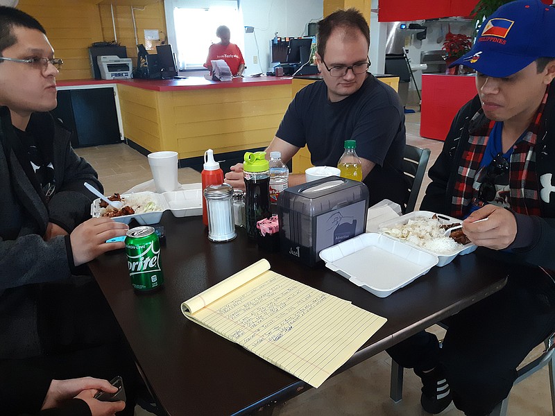 A group of customers from New Boston, Texas, dig into their orders at Kyoto Teriyaki. They said social media was a big part of what drew them to Texarkana to try the food.