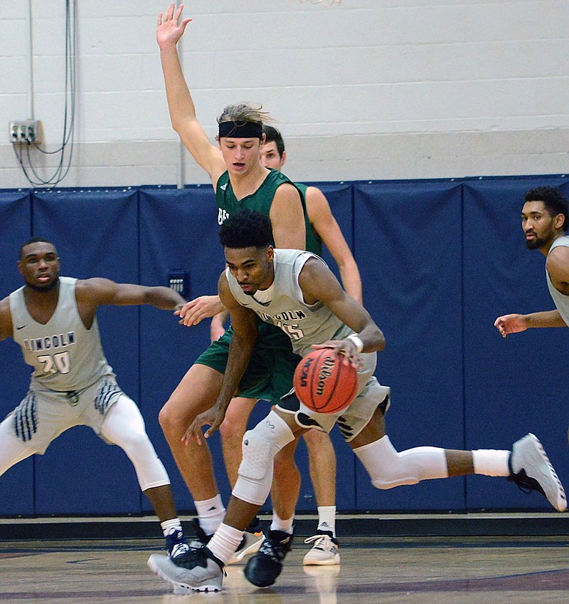 Jonell Burton of Lincoln dribbles the ball during Thursday night's game against Northwest Missouri at Jason Gym.