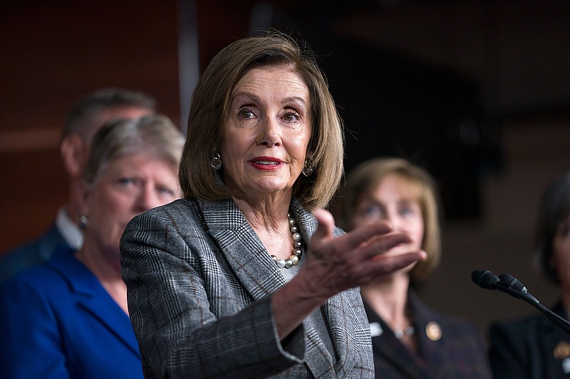 Speaker of the House Nancy Pelosi, D-Calif., discusses her recent visit to the UN Climate Change Conference in Madrid, Spain, during a news conference with the congressional delegation to that summit, at the Capitol in Washington, Friday, Dec. 6, 2019. (AP Photo/J. Scott Applewhite)