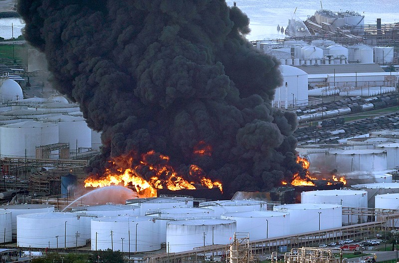 In this Monday, March 18, 2019 file photo, Firefighters battle a petrochemical fire at the Intercontinental Terminals Company in Deer Park, Texas. A fire at a Houston-area petrochemical storage facility that burned for days in March was accidental and caused by equipment failure at a storage tank, according to a report released by local and federal investigators, Friday, Dec. 6, 2019  (AP Photo/David J. Phillip, File)