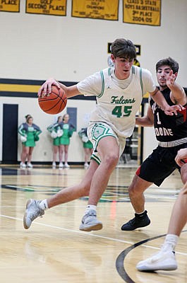 Luke Northweather of Blair Oaks tries to drive past Southern Boone's Nik Post during Saturday's Tri-County Conference Tournament championship game in Versailles.