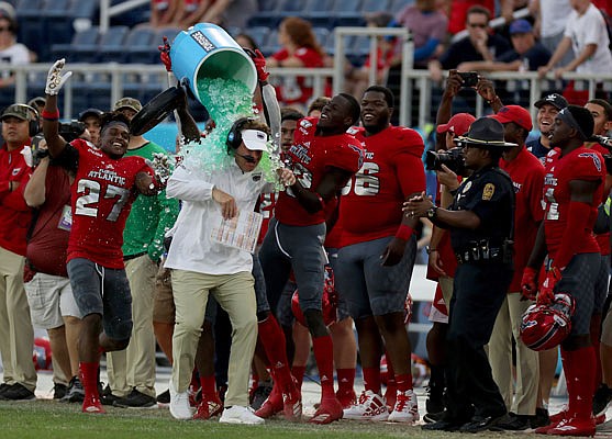 Florida Atlantic head coach Lane Kiffin is doused Saturday as his team celebrates defeating UAB in the Conference USA title game in Boca Raton, Fla.
