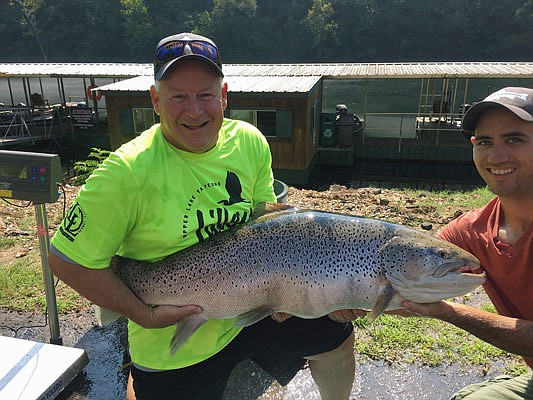 Bill Babler (left) holds the new state-record brown trout with his friend, Ryan Titus. The fish was caught Sept. 4 at Lake Taneycomo, weighing in at 40 pounds, six ounces.