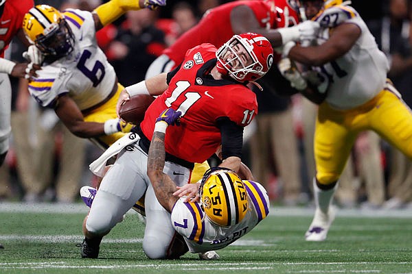 LSU safety Grant Delpit sacks Georgia quarterback Jake Fromm during Saturday afternoon's SEC title game in Atlanta.