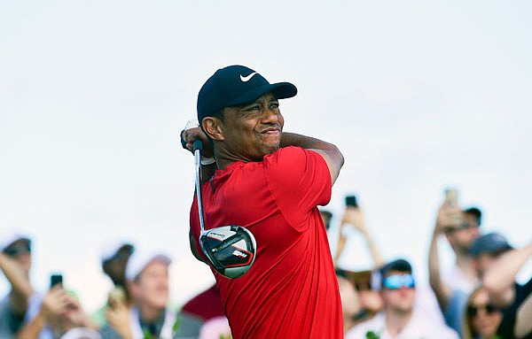 Tiger Woods follows his ball at the first tee during Saturday's final round of the Hero World Challenge at Albany Golf Club in Nassau, Bahamas.