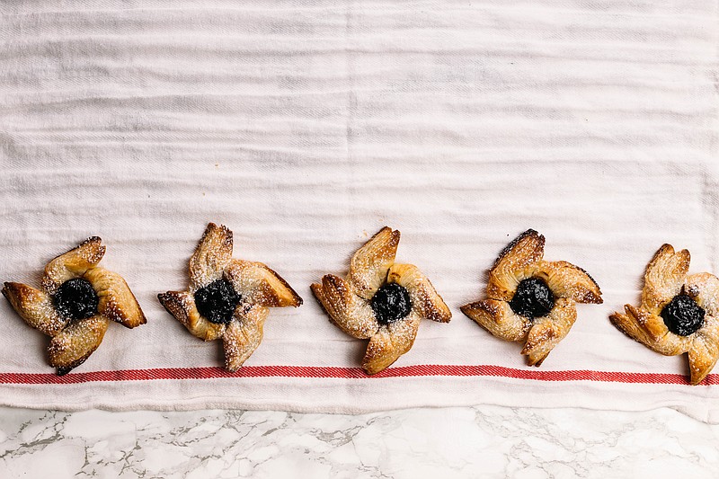 Joulutorttu are Finnish Christmas pinwheels with a dollop of prune jam in the middle of each one. (AdobeStock)
