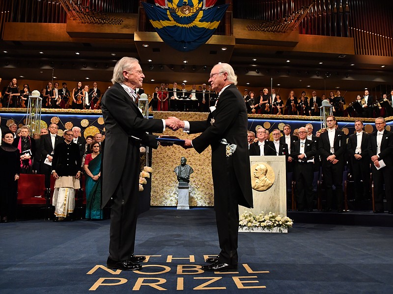 Austrian author Peter Handke, left, receives the 2019 Nobel Prize from King Carl Gustaf of Sweden, during the Nobel Prize award ceremony at the Stockholm Concert Hall, in Stockholm, Tuesday, Dec. 10, 2019. (Jonas Ekstromer/TT News Agency via AP)