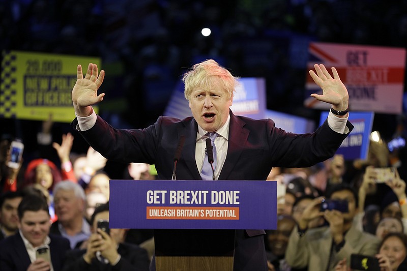 Britain's Prime Minister Boris Johnson speaks during his ruling Conservative Party's final election campaign rally at the Copper Box Arena in London, Wednesday, Dec. 11, 2019. Britain goes to the polls on Dec. 12. (AP Photo/Kirsty Wigglesworth)